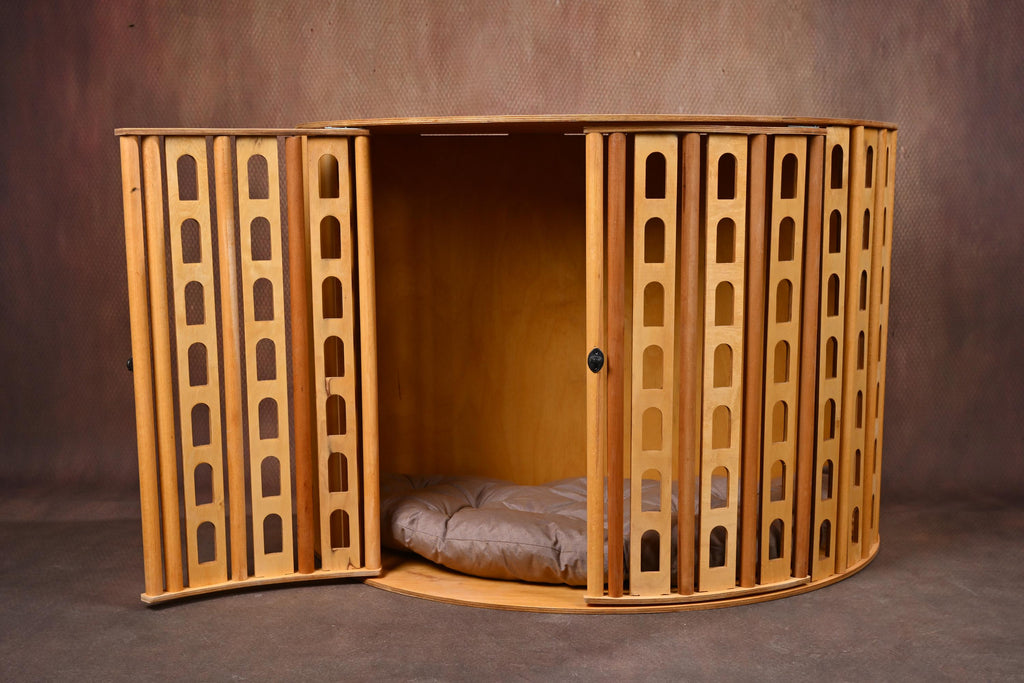 Indoor wooden dog crate with open front doors showing interior space
